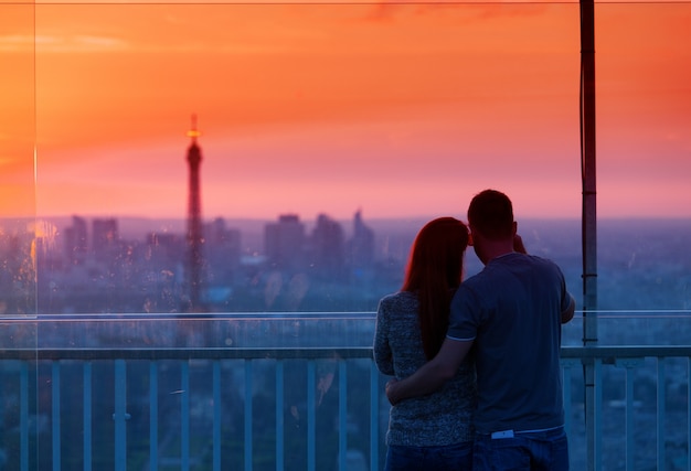 Couple in love admiring the Eiffel tower