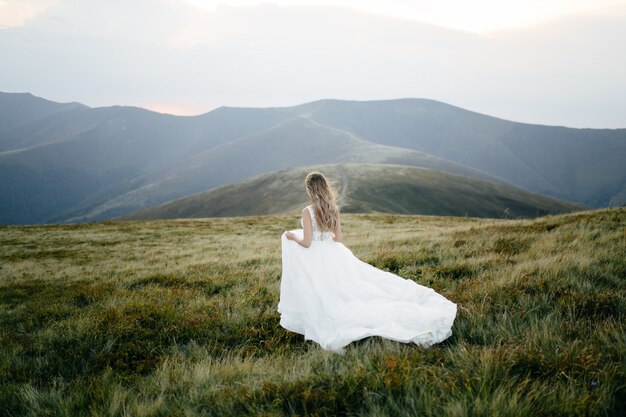 Couple in love kissing on nature travel in mountains