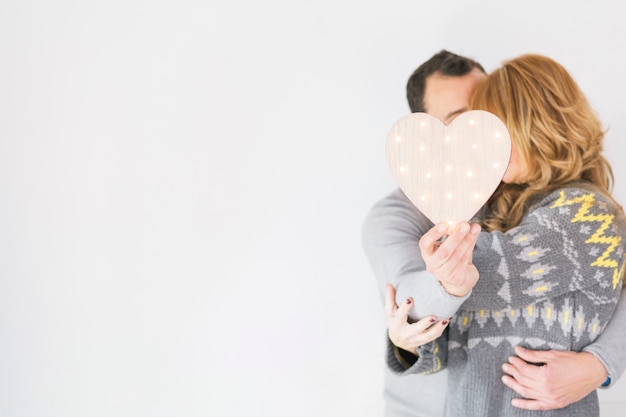 Couple in love posing with heart