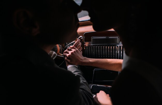 couple in love in retro car 