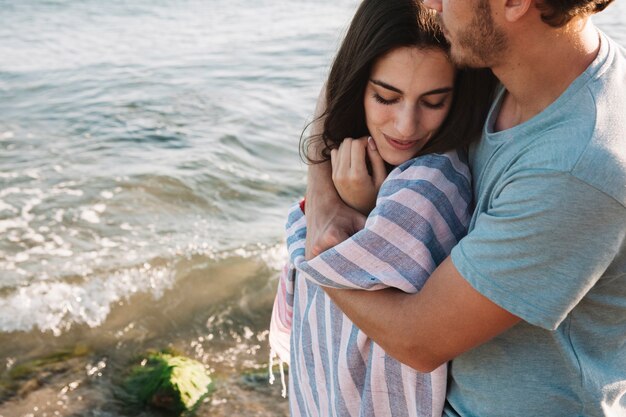 Couple love scene at the shoreline