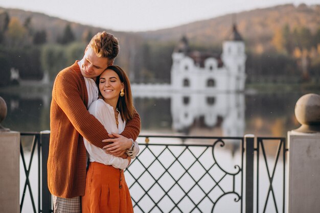 Couple in love standing tohether by the lake