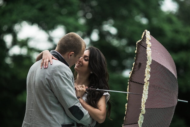 Free photo couple in love with an umbrella