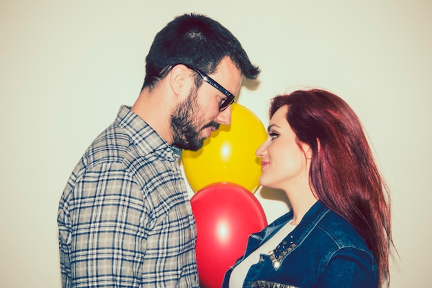 Free photo couple of lovers and balloons