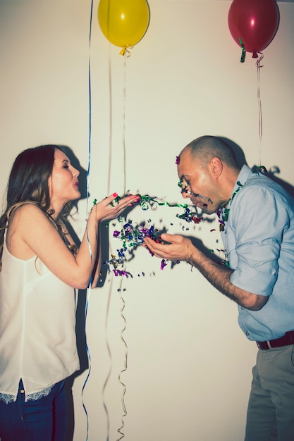 Couple of lovers playing with confetti