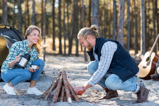 Couple making a campfire