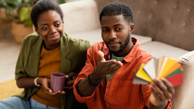 Couple making plans together for renovating home using color palette