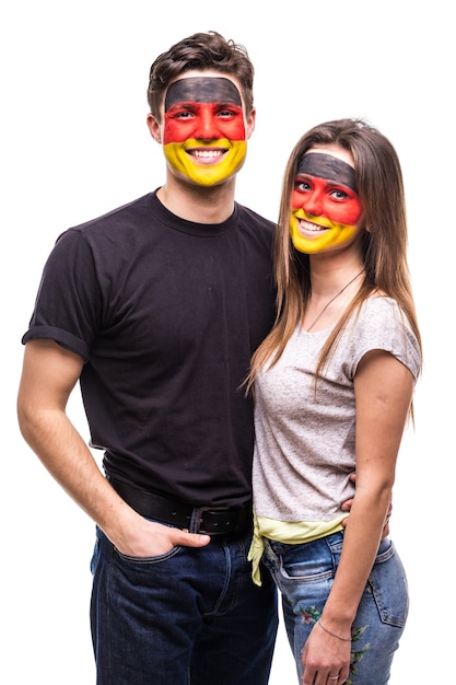 Couple, man and woman, fans suport together Germany national teams painted flag face. Fans emotions.