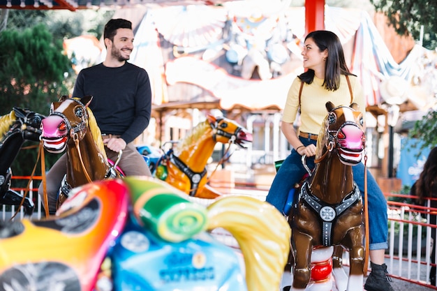 Free photo couple in the merry-go-round