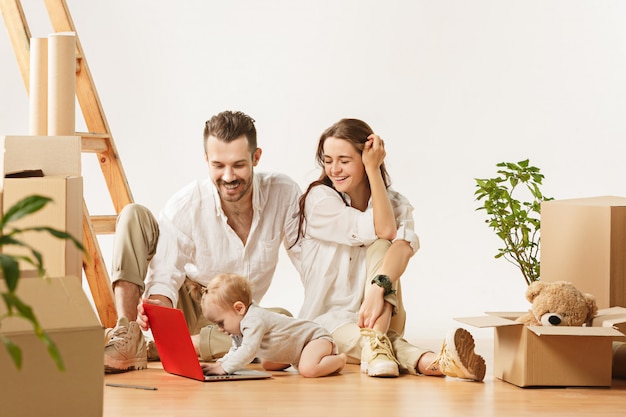 Couple moving to a new home - Happy married people buy a new apartment to start new life together