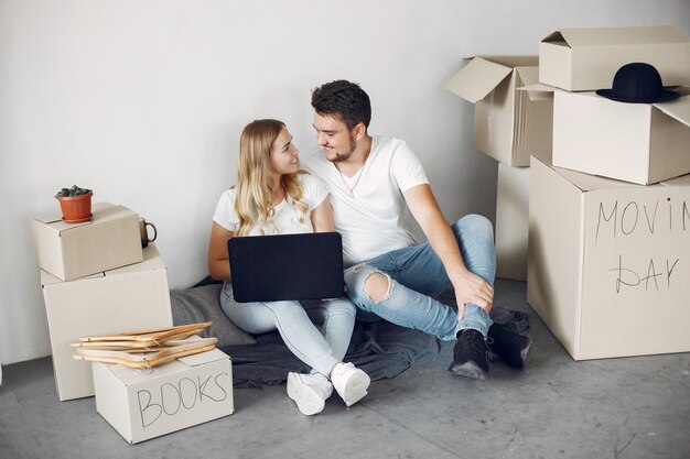 Couple moving and using boxes