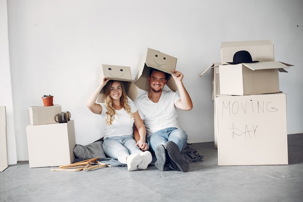 Couple moving and using boxes