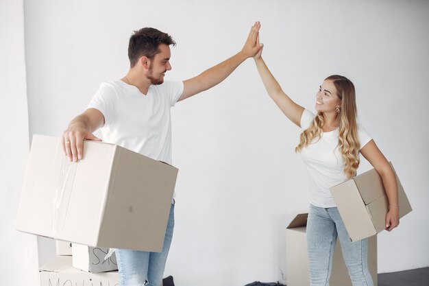 Couple moving and using boxes