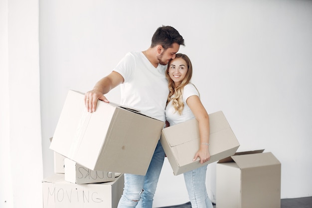 Couple moving and using boxes