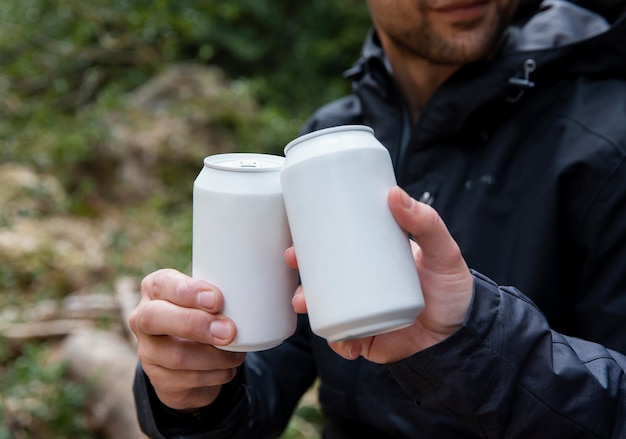 Couple in nature drinking beverage close up