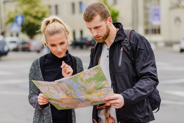 Couple navigating with map