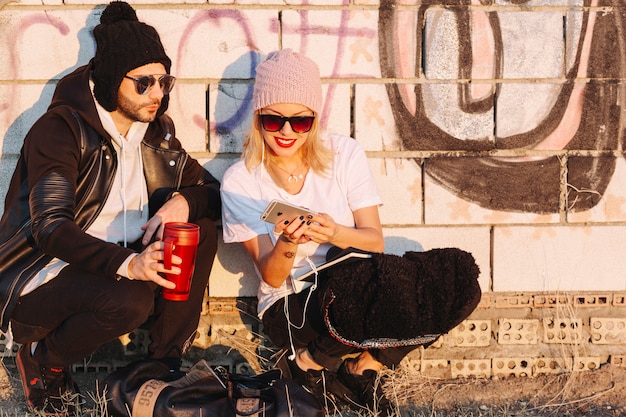 Free photo couple near brick wall