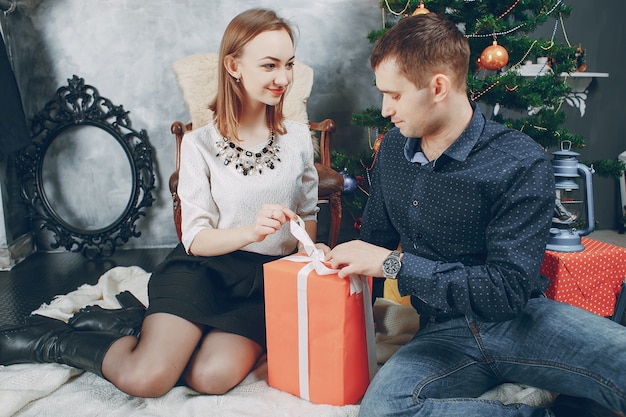 Free photo couple near christmas tree