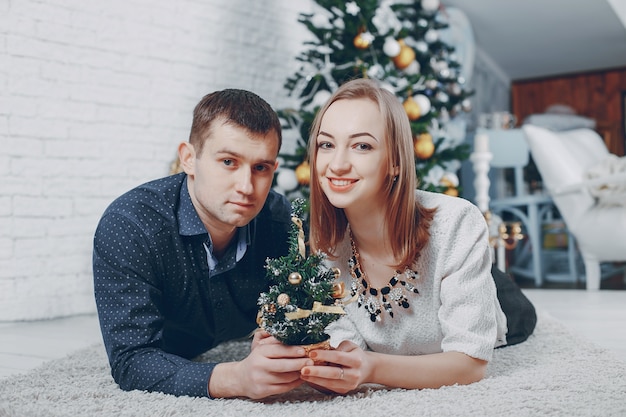 couple near christmas tree