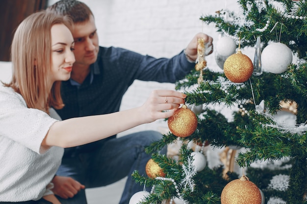 couple near christmas tree