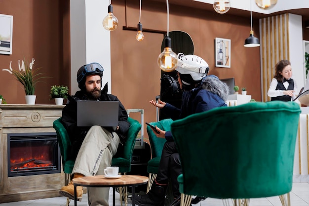 Free photo couple near fireplace with devices