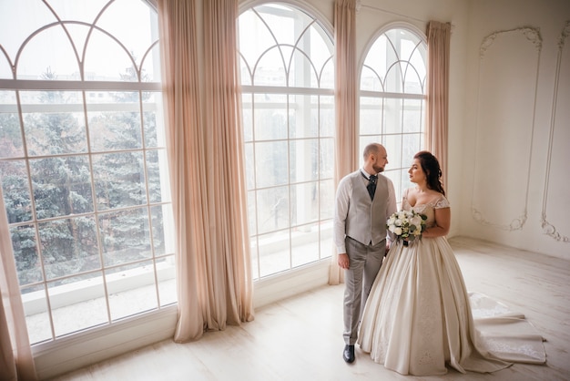 Free photo couple of newlyweds posing