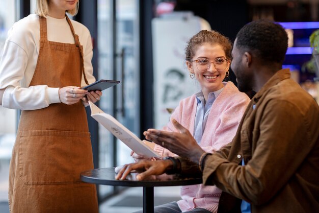 Couple ordering food at restaurant