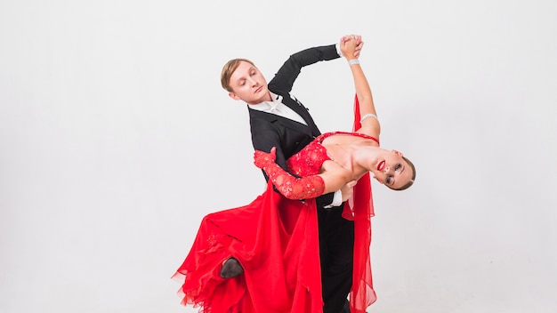 Couple performing ballroom dance move