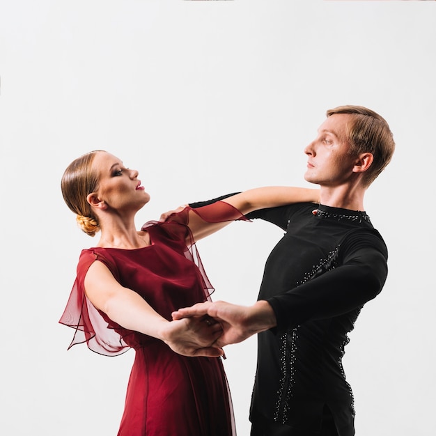 Free photo couple performing dance on white background