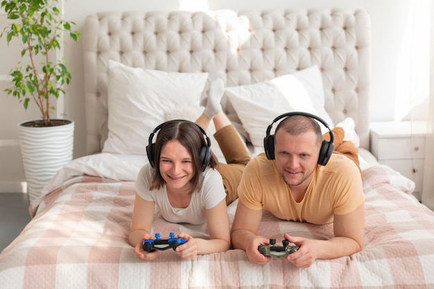 Couple playing together videogames at home