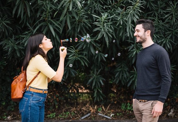 Couple playing with bubbles