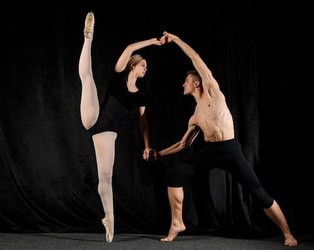 Free photo couple posing in ballet outfits