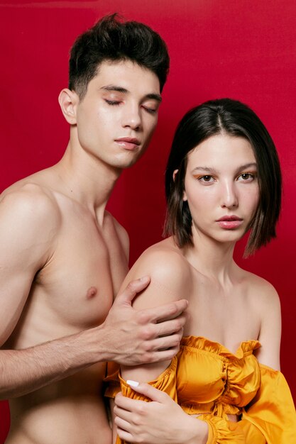 Couple posing bare and in yellow top