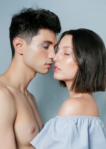 Couple posing seductively and almost kissing