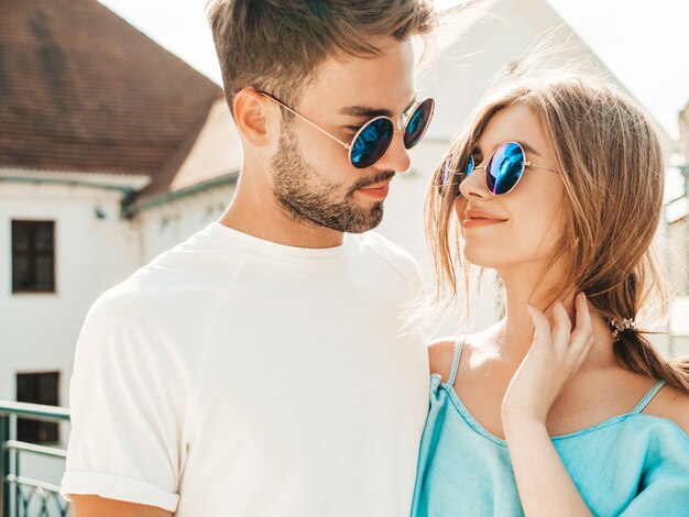 Couple posing on the street in sunglasses