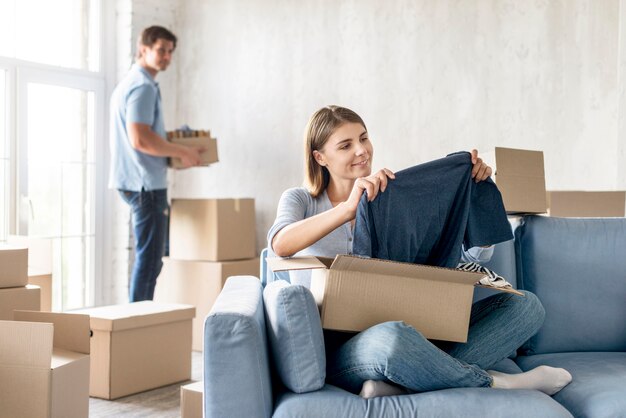 Couple preparing boxes to move house