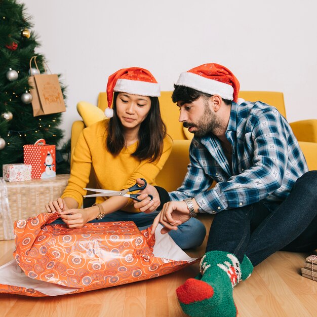 Couple preparing christmas present