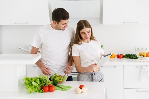 Couple preparing salad