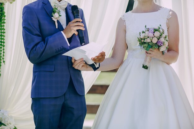 Couple reading their vows