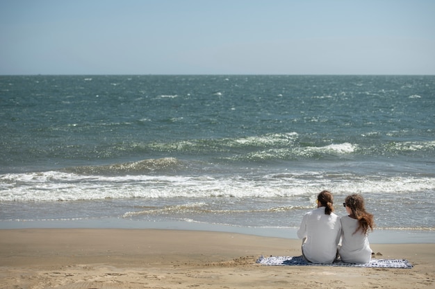 Couple relaxing on the beach during vacation