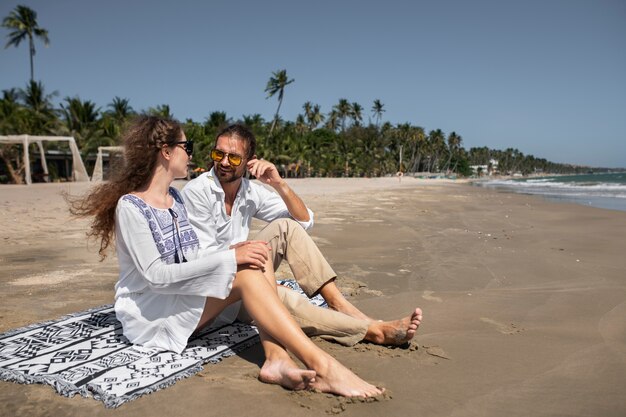 Couple relaxing on the beach during vacation