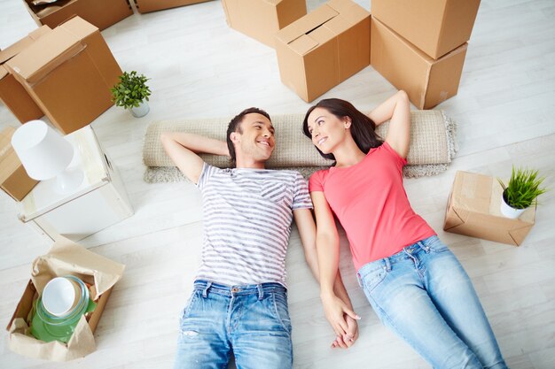 Couple resting on the floor