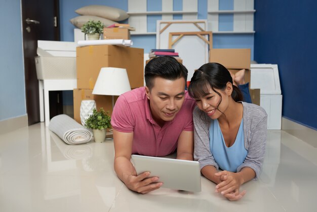 Couple Resting In New Apartment