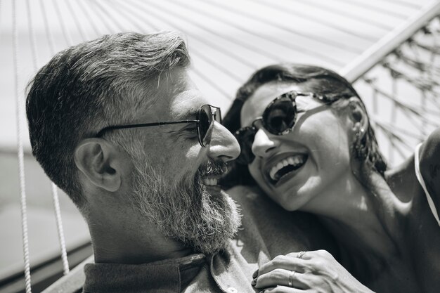 Couple resting together in a hammock