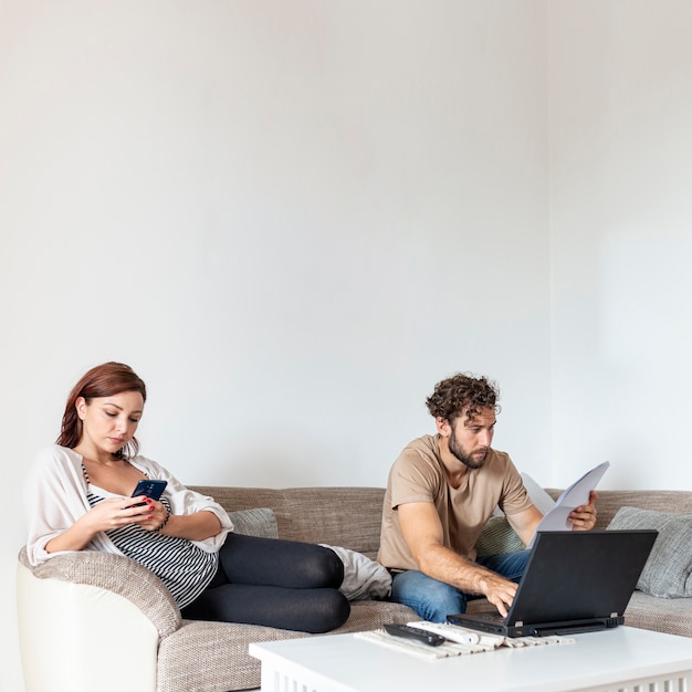 Couple resting together on the sofa