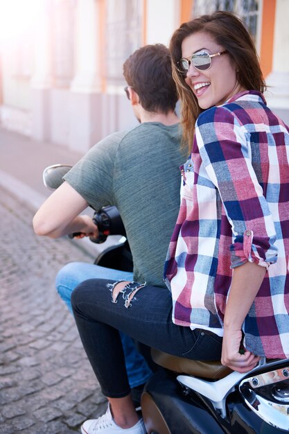 Couple riding a motorcycle in the city