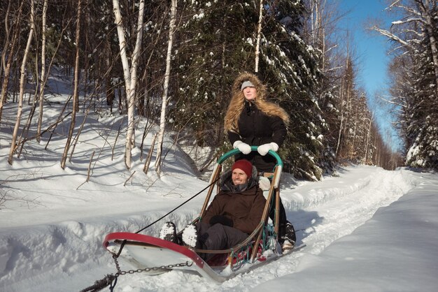 Couple riding the sledge