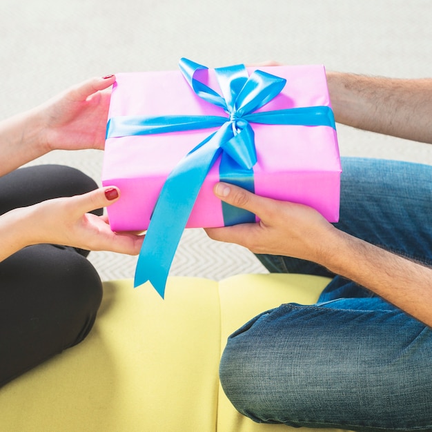 Couple's hand holding valentine gift