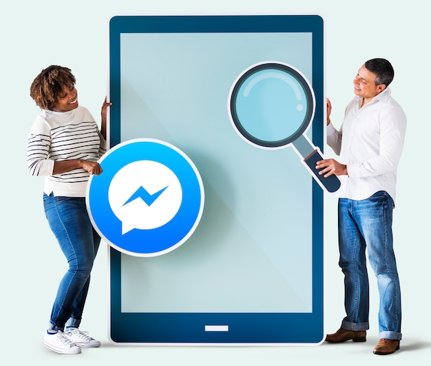 Couple searching for Facebook Messenger on a phone
