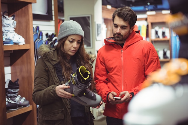 Couple selecting shoe in a shop